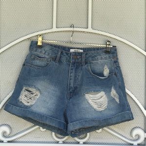 Blue washed ripped high rise denim jeans